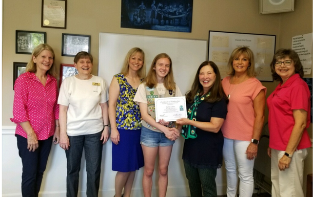 girl scout recieving an award