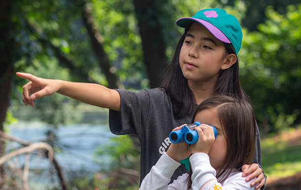 girl scouts with binoculars