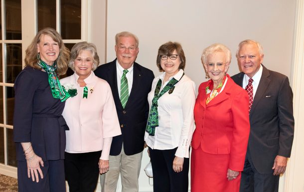 woman of distinction honoree with girl scout members and family
